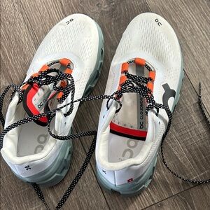 White and Orange Athletic Shoes
